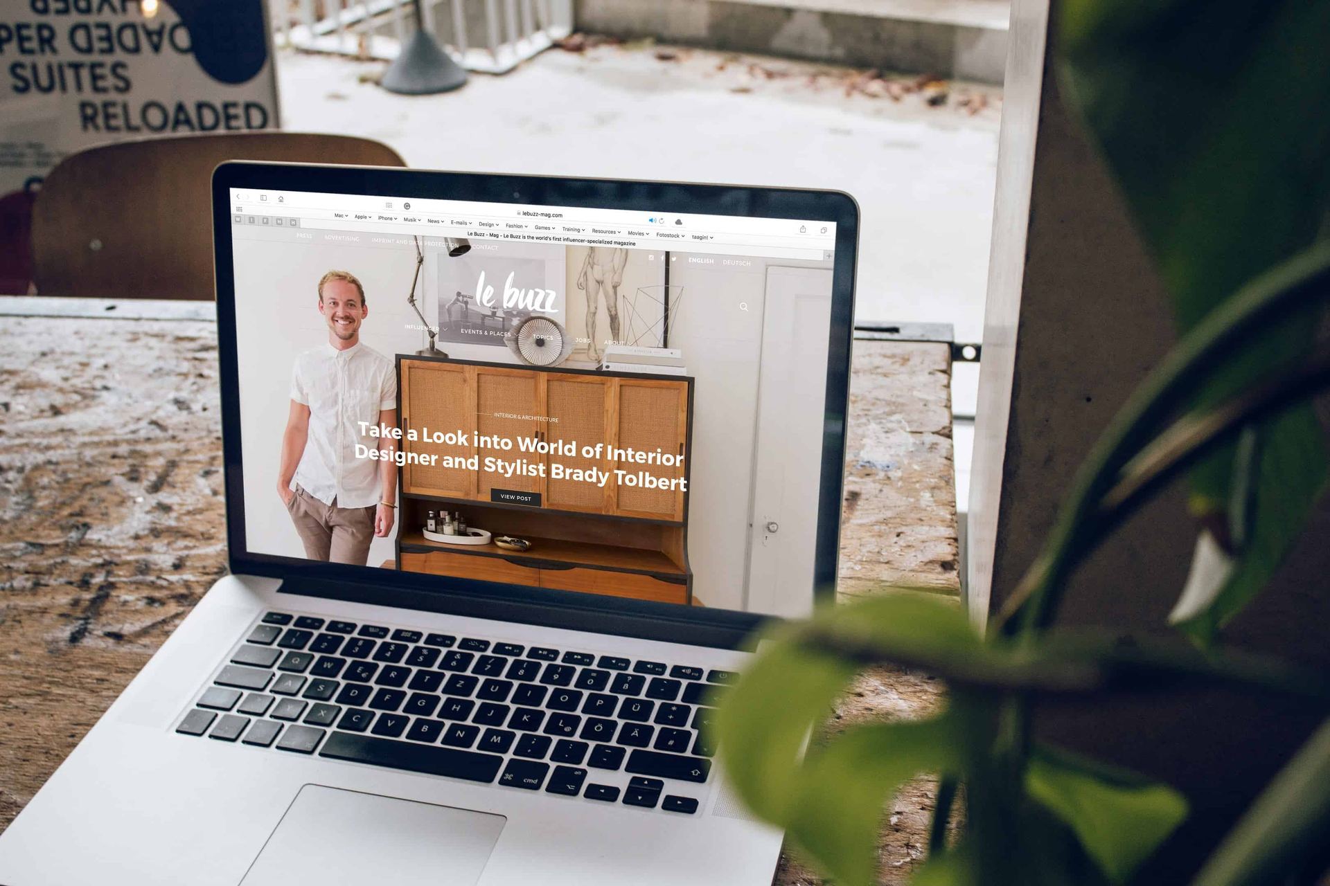 A laptop on a desk showing a website design in progress