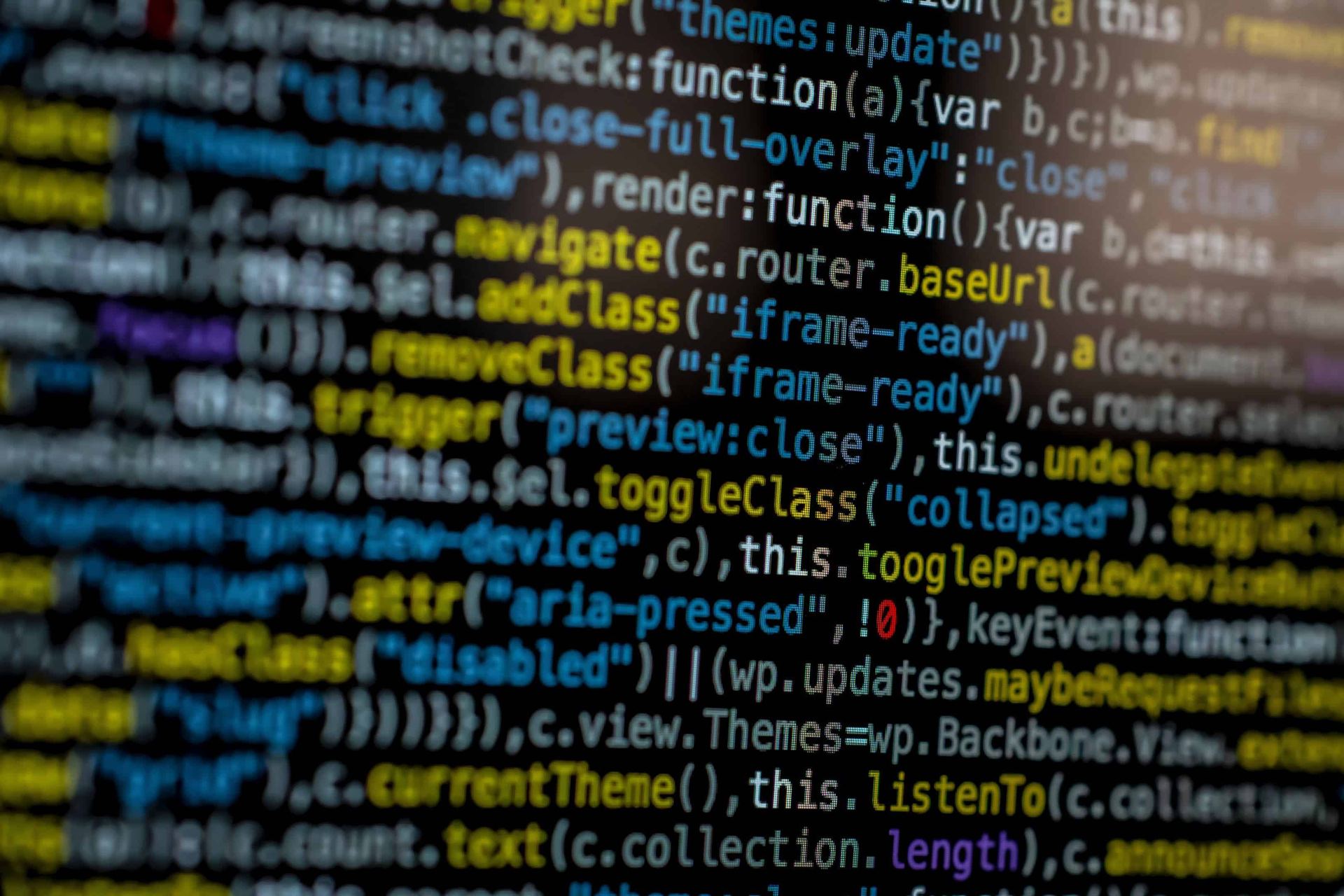 A screen full of website source code being edited